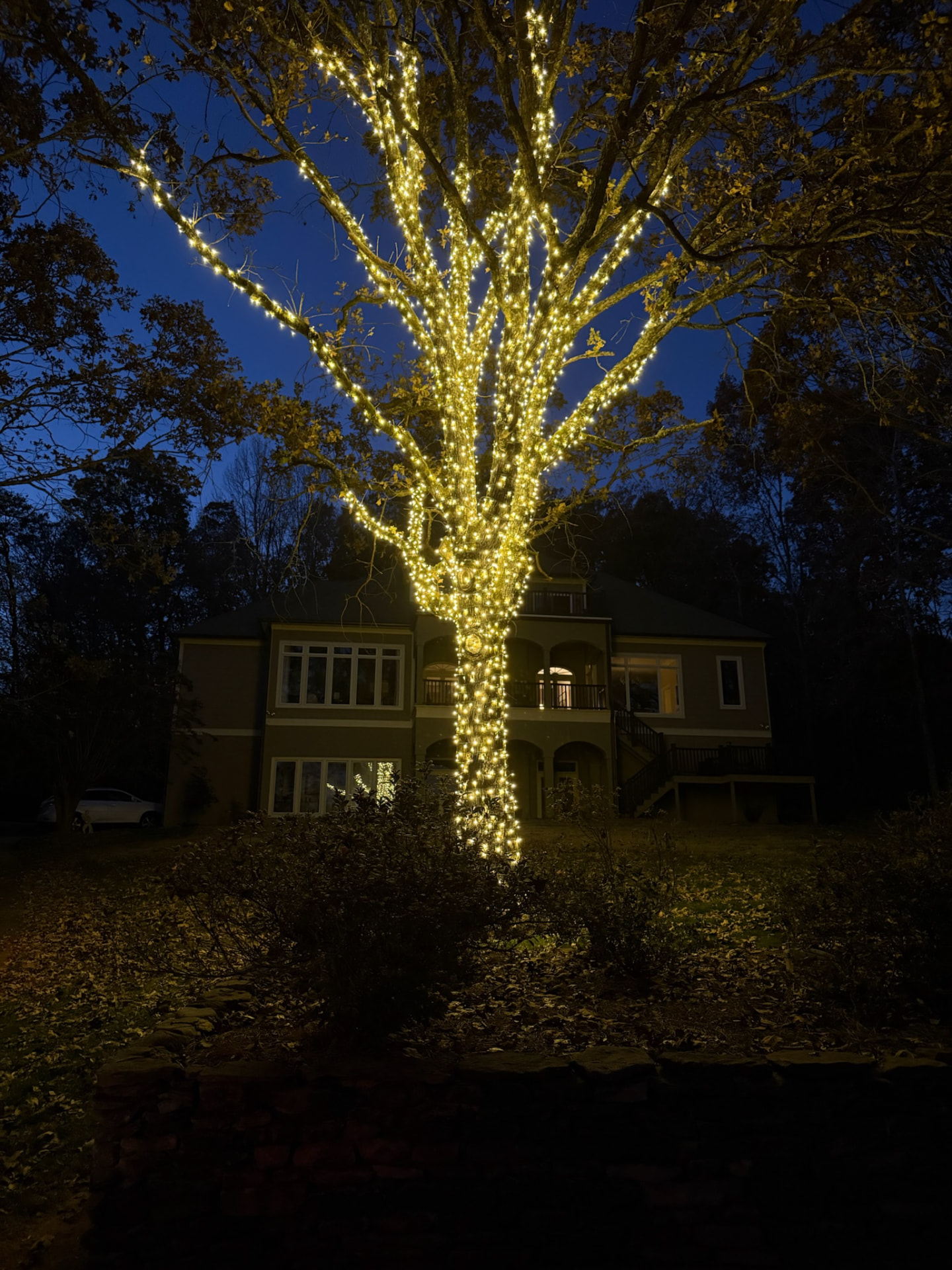 Permanent LED holiday lighting installed under the eaves of a Maryville home